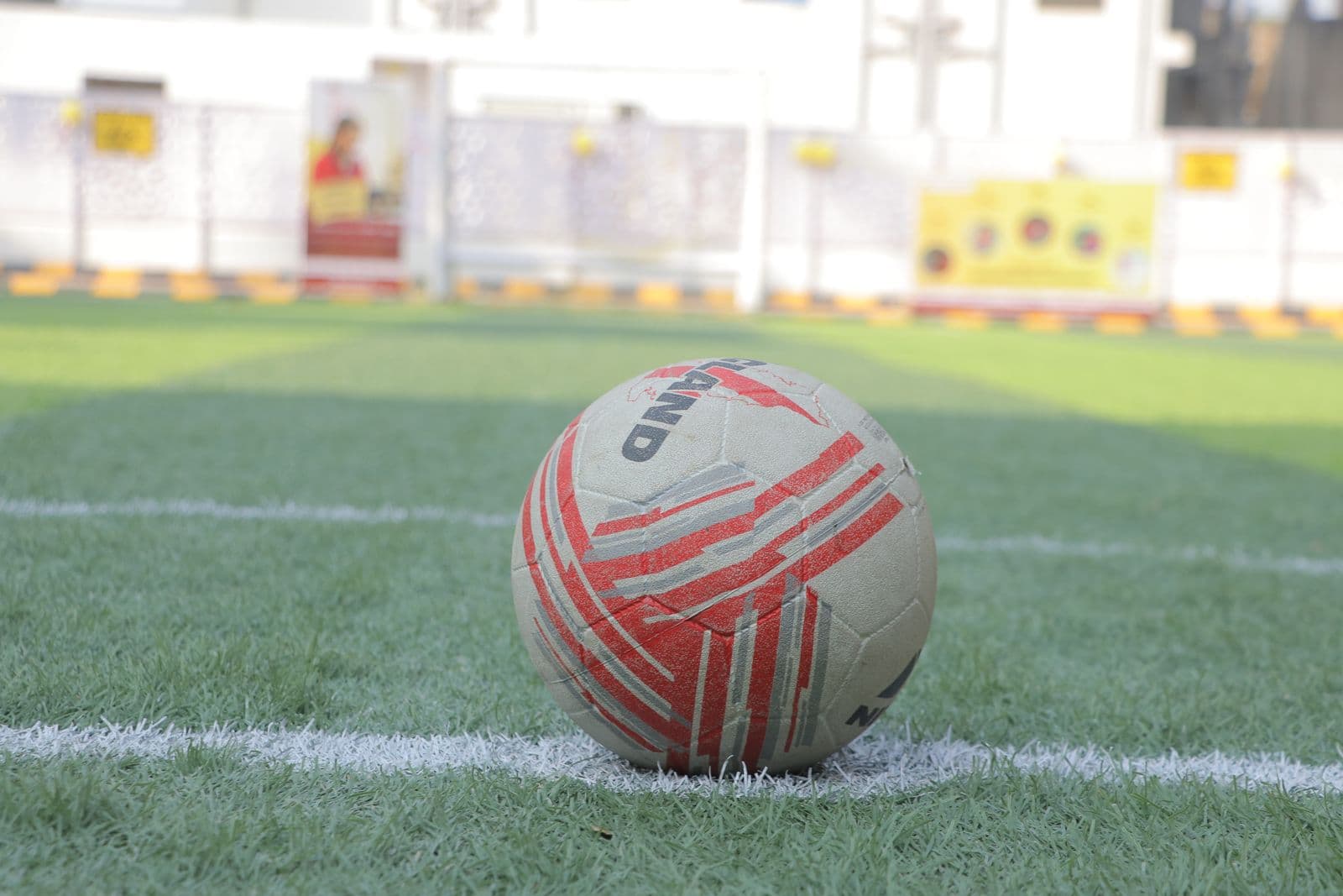 Ball resting on the corner of the pitch